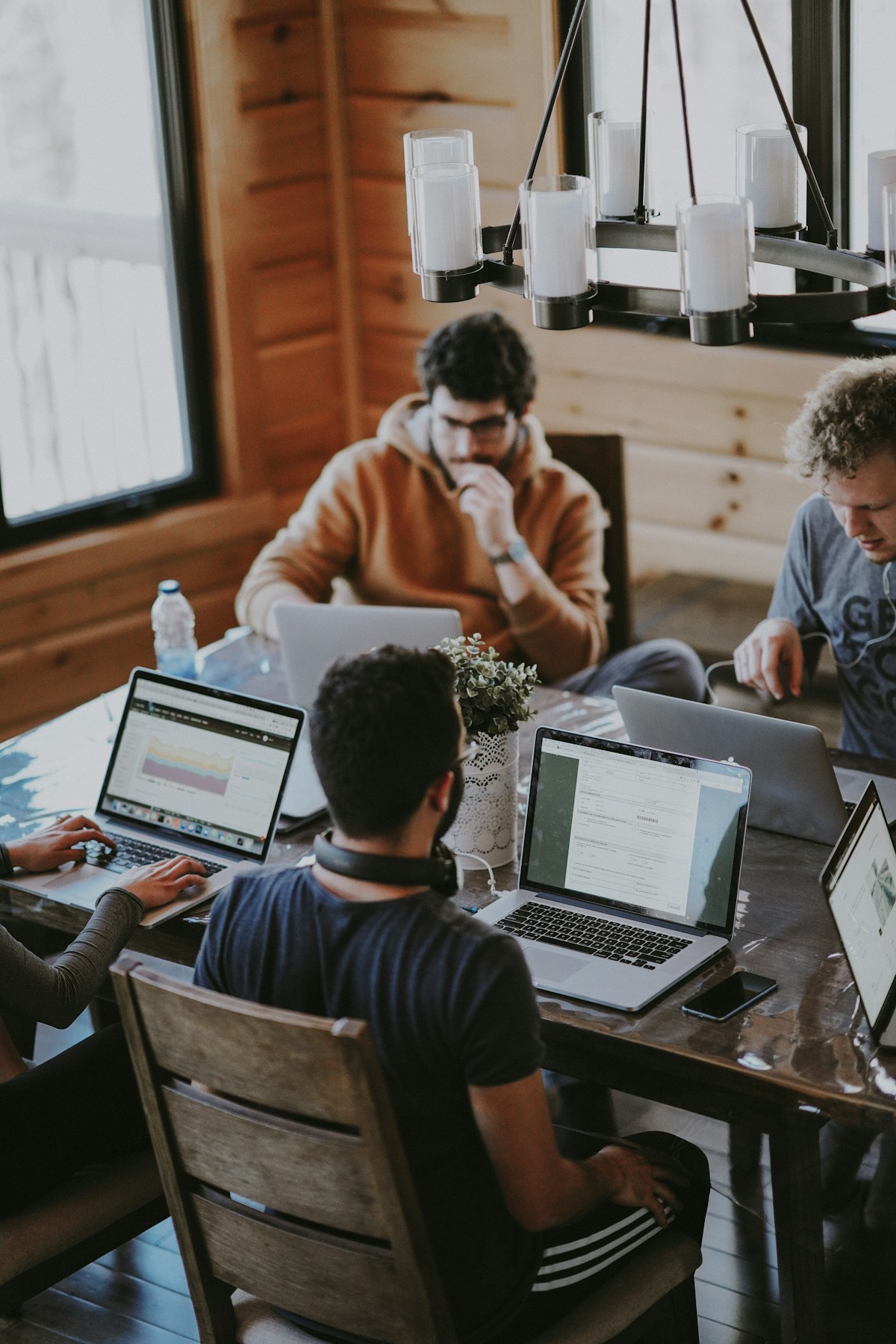 Colleagues collaborating around a table in a modern workspace
